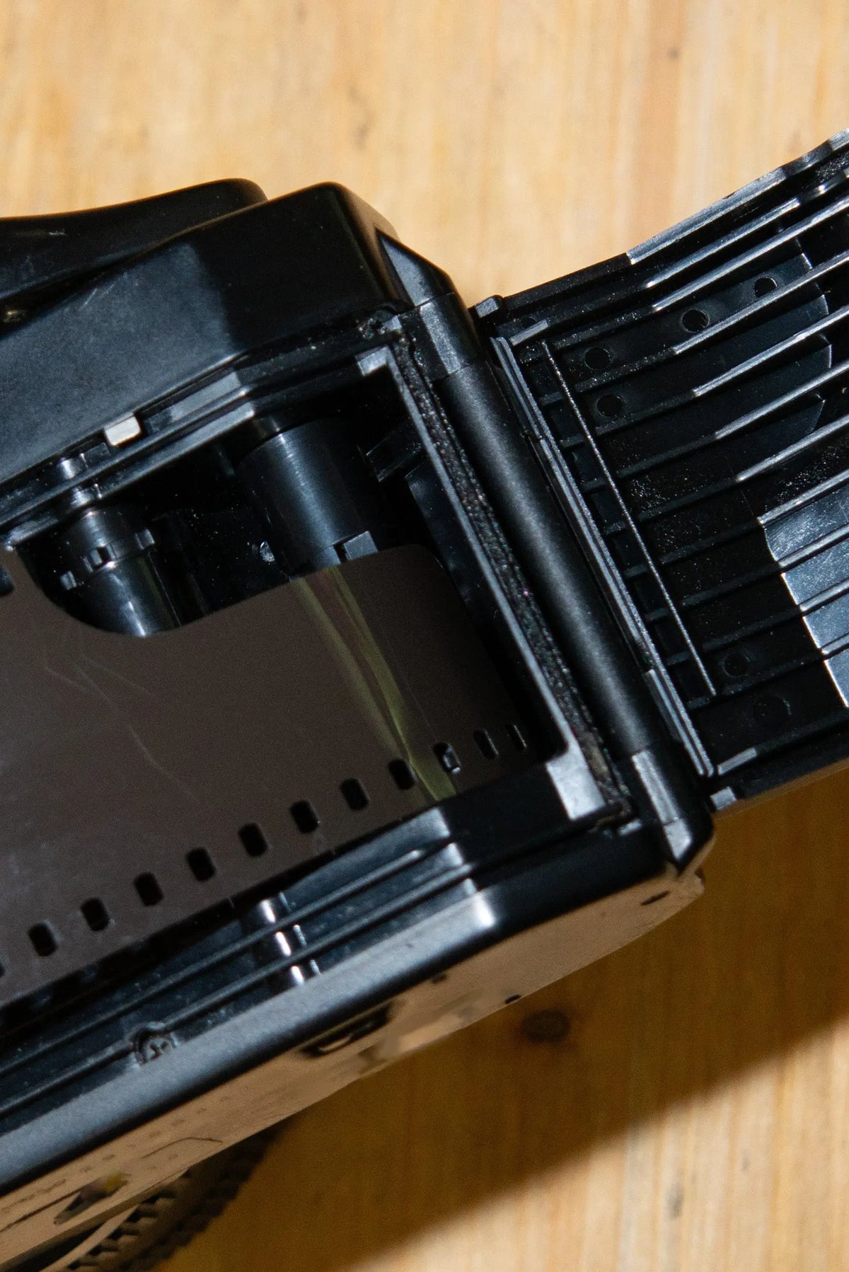 Open film camera showing the film transport mechanism