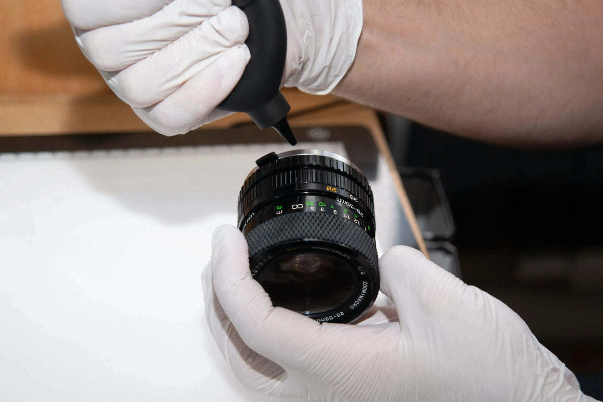 Old film camera light seals being removed before professional replacement