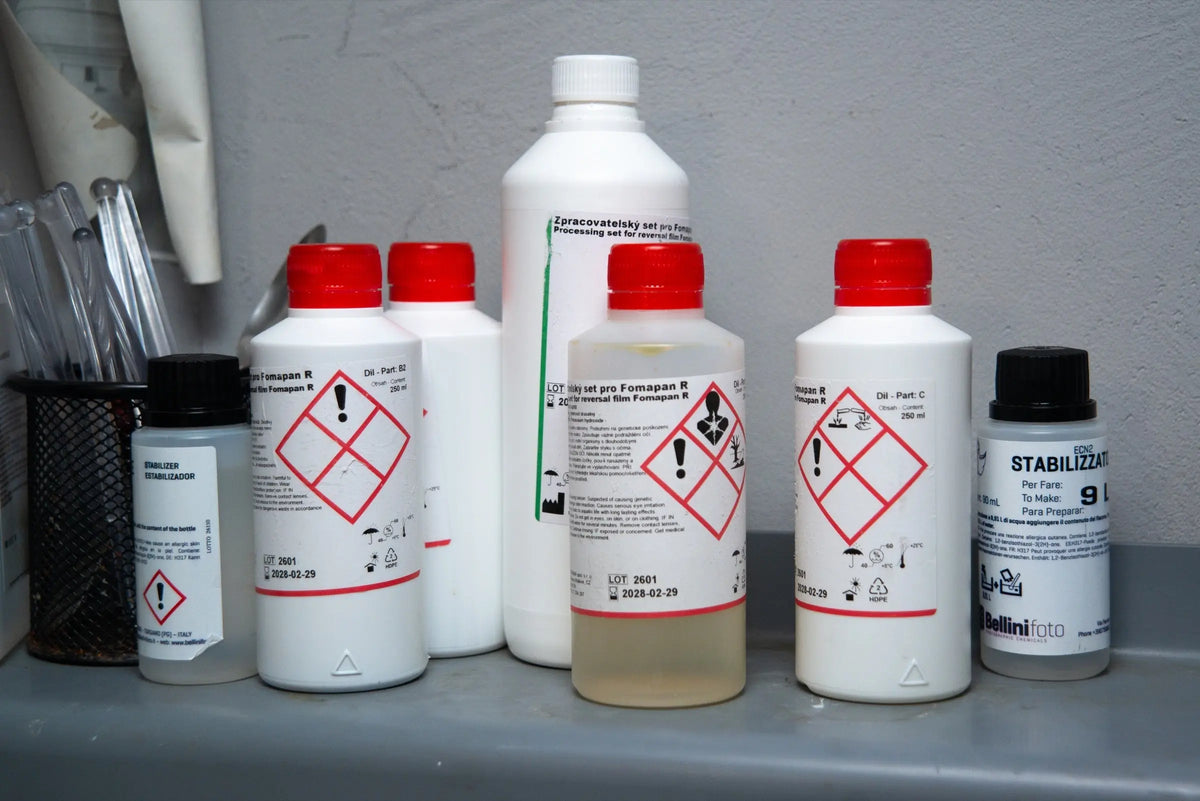 Labelled photographic chemical containers in the laboratory