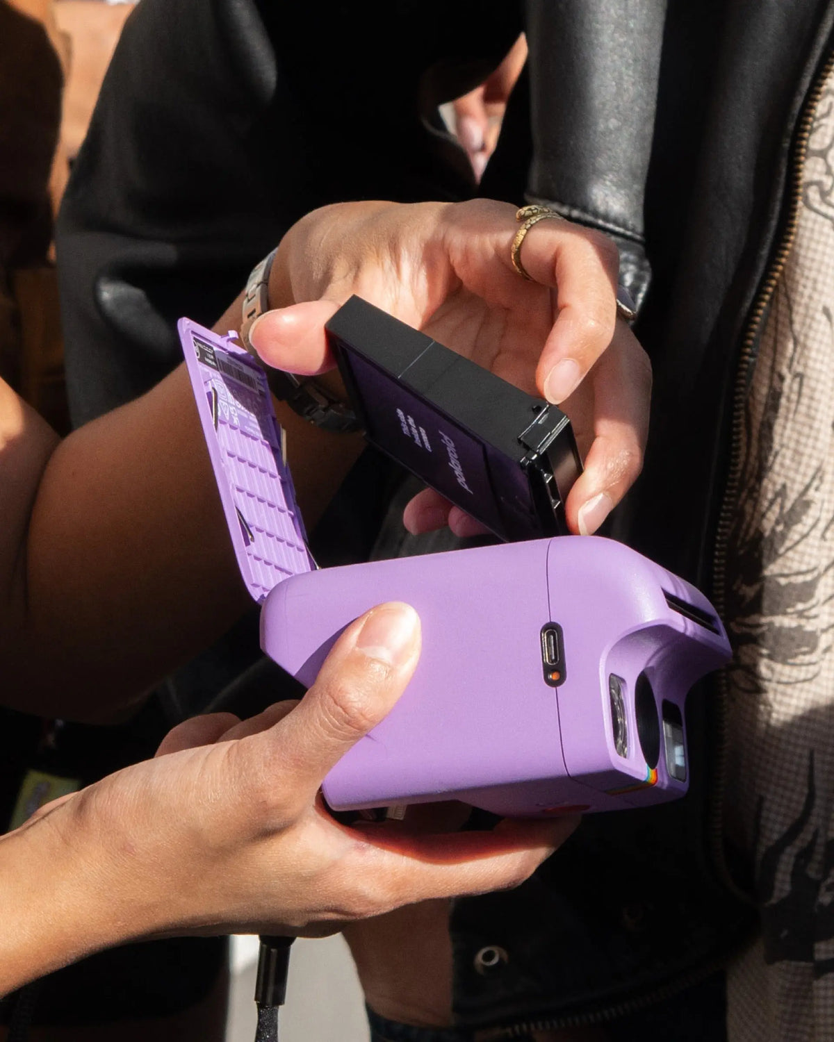 Open instant camera being checked before loading