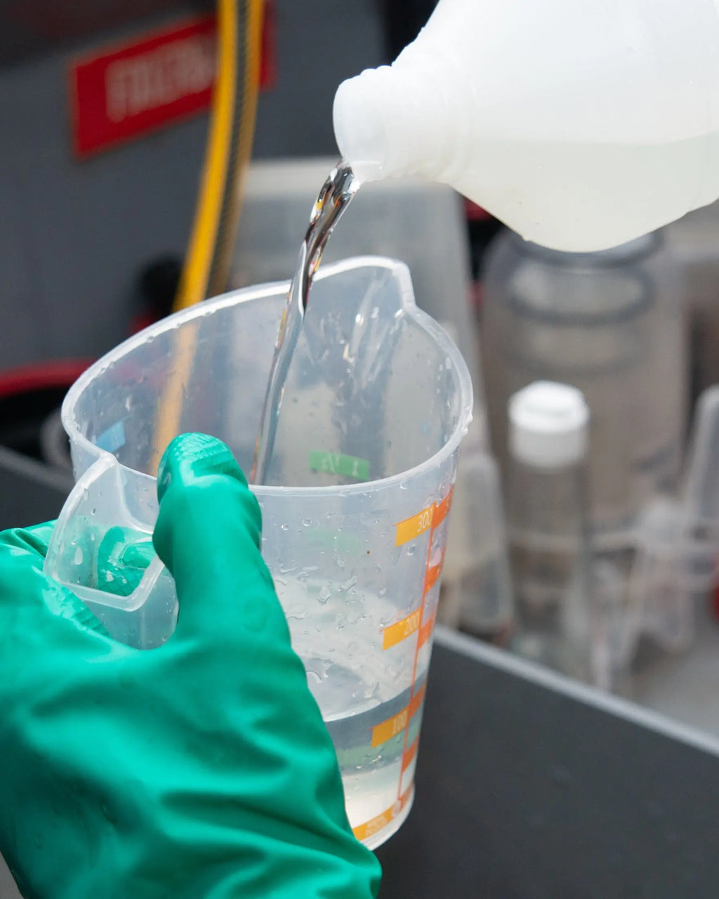 Close-up of liquid being poured into a graduated jug at Berlin Photo Studio