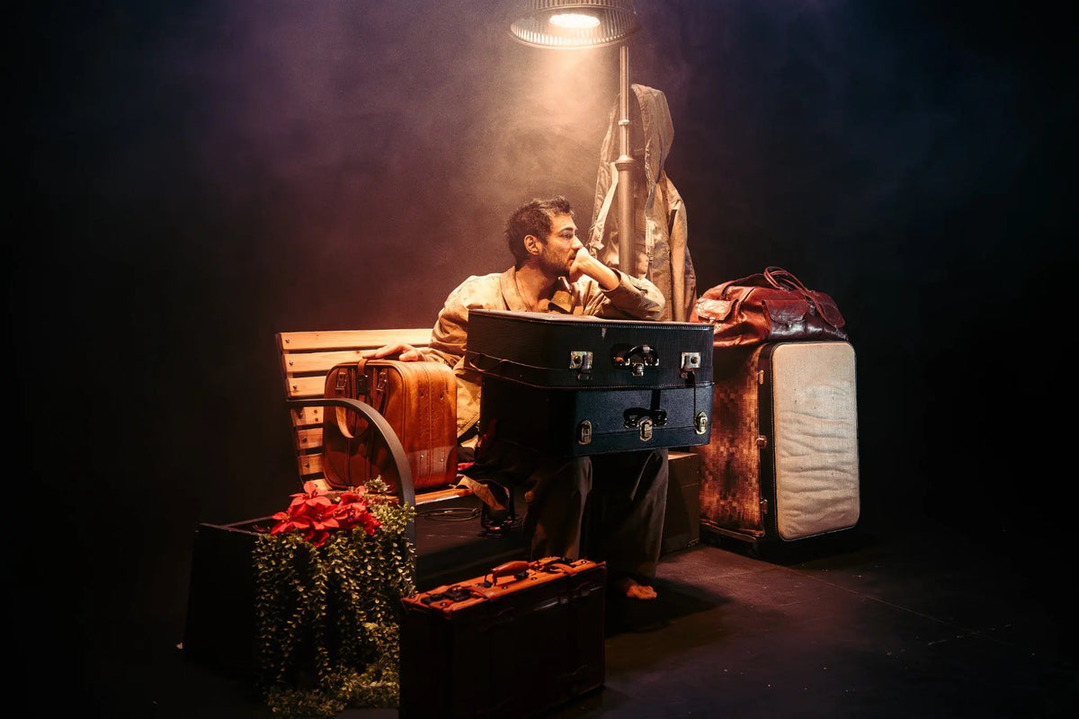 Theatre performance photographed on stage in warm dramatic lighting